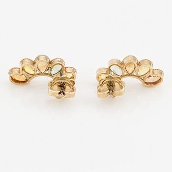 A pair of 14K gold earrings with multicolored sapphires.