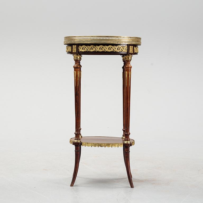 A French Louis XVI-style table, first half of the 20th century.