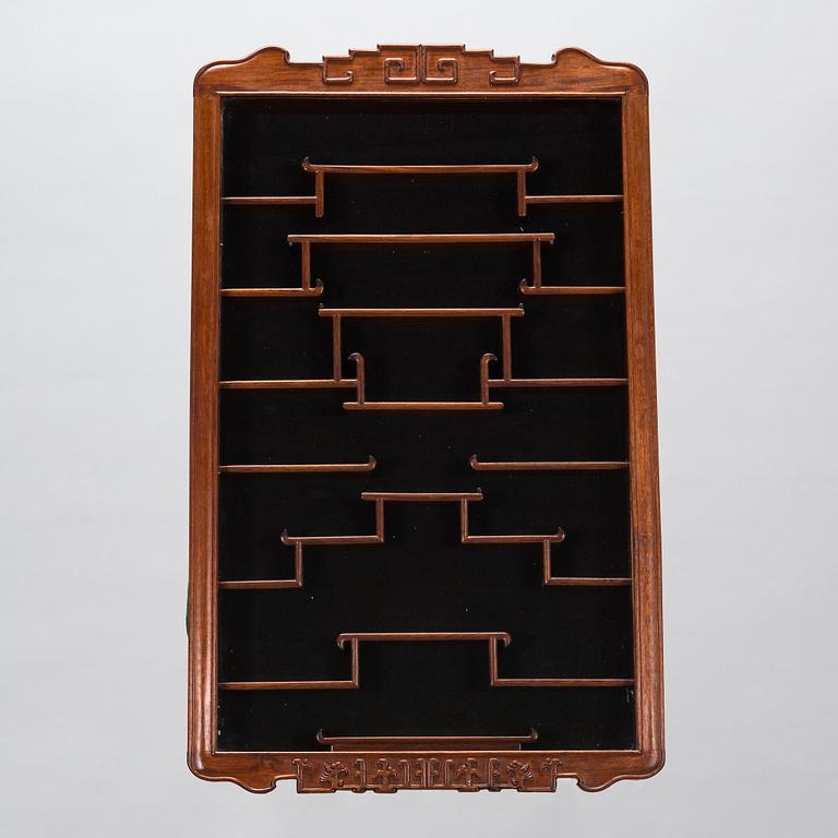 A Chinese 20th century hardwood wall cabinet.