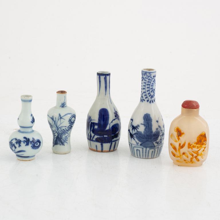 A Chinese stone snuff bottle and four porcelain miniature vases, part 18th century.