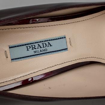 a pair of pumps by Prada, in size 39.