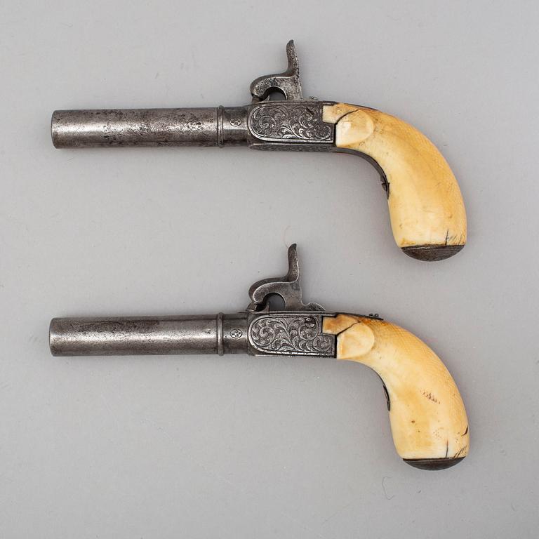 A mid 19th century Belgian rifled percussion pistols with ivory butts in a case.
