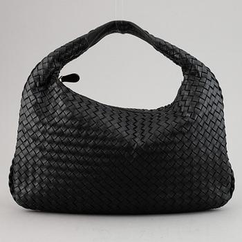 Bottega Veneta, a black leather bag.