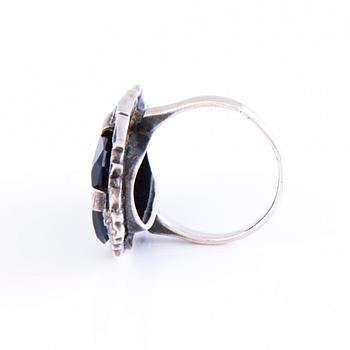 Four Art deco jewelry, ring, pendant necklace and earrings in silver.