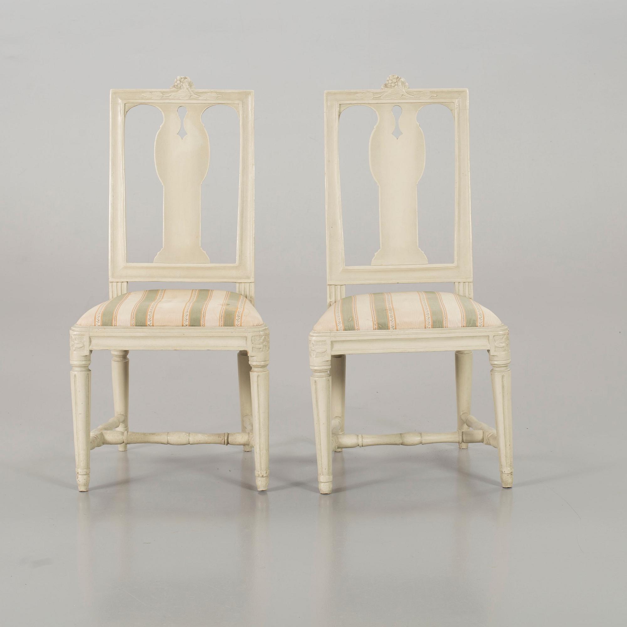 A piar of signed Swedish Gustavian chairs.