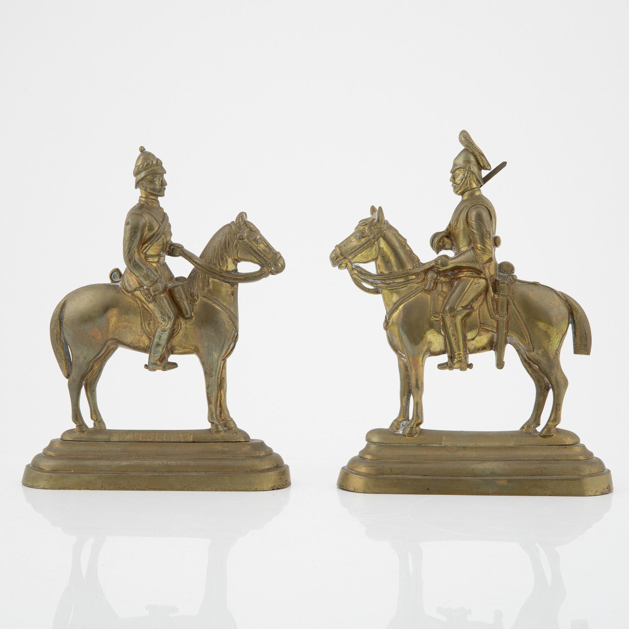 A pair of brass book stands,