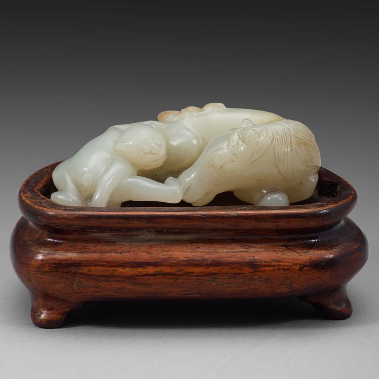 A chinese nephrite figure of a reclining horse and a monkey, early 20th Century.