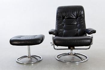 A leather swivel armchair and stool, Söderbergs  1980s.