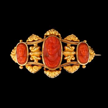 60. A 19th century carved coral cameo brooch.