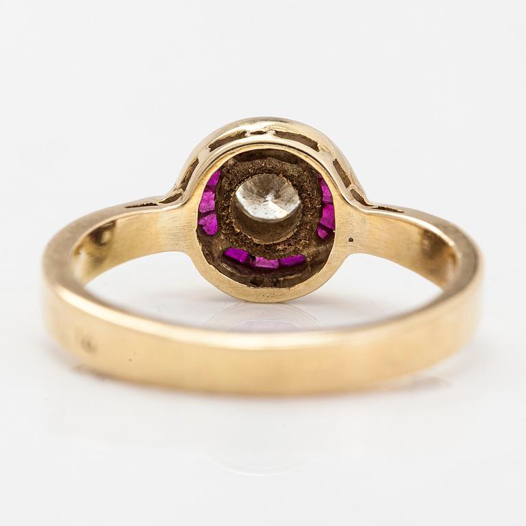 A 14K gold ring with a diamond ca. 0.23 ct and rubies.