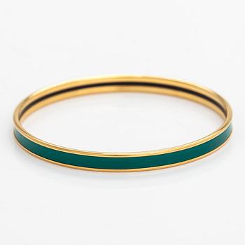 Hermès, a bracelet made of gold coloured metal and green enamel. Marked Hermès Paris, Made in France.