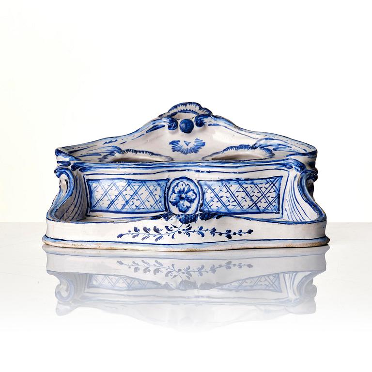 A Swedish unmarked Rörstrand rococo faience desk set, 18th century.