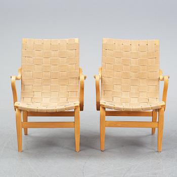 A pair of 'Eva' easy chairs by Bruno Mathsson for Firma Karl Mathsson, dated 1974.