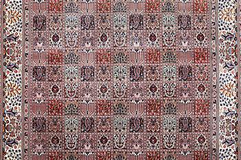 A part silk Ghom carpet, c. 346 x 251 cm.