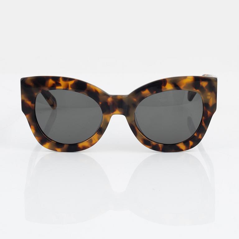 Karen Walker, a pair of tortoise "Northern lights" sunglasses.