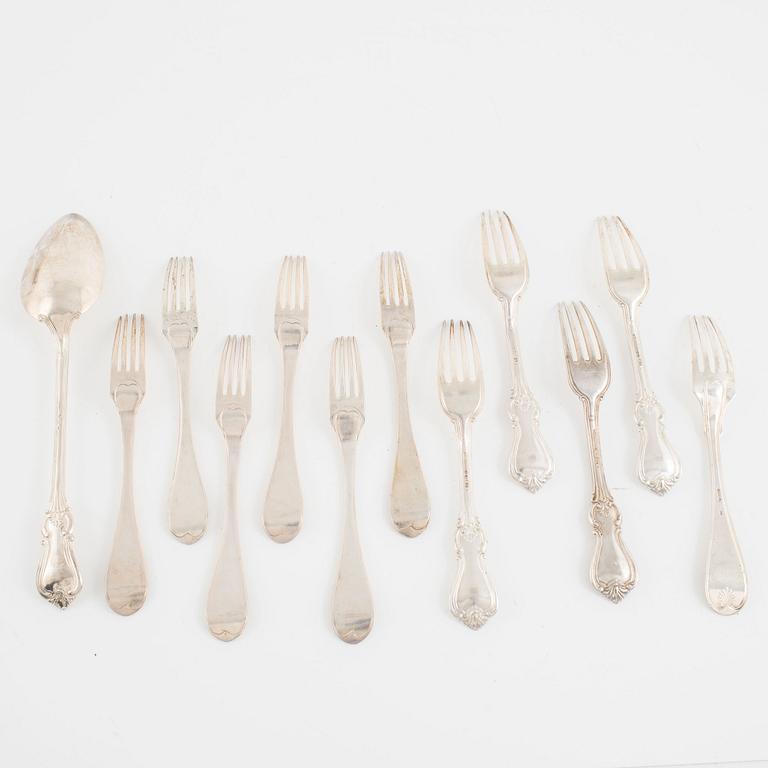 A group of eleven Swedish silver forks and a spoon, 19th Century.