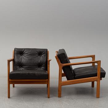 KARL ERIK EKSELIUS, a pair of 1960's teak armchairs.