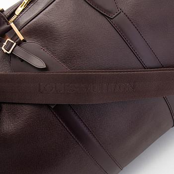 Louis Vuitton, a 'Taiga Kendall PM' weekend bag.