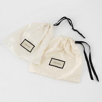 Gucci, two belts, 2017.