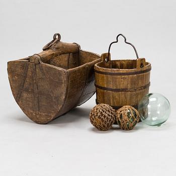 A wooden scoop and bucket and three glass spheres, 18th and 19th Century.