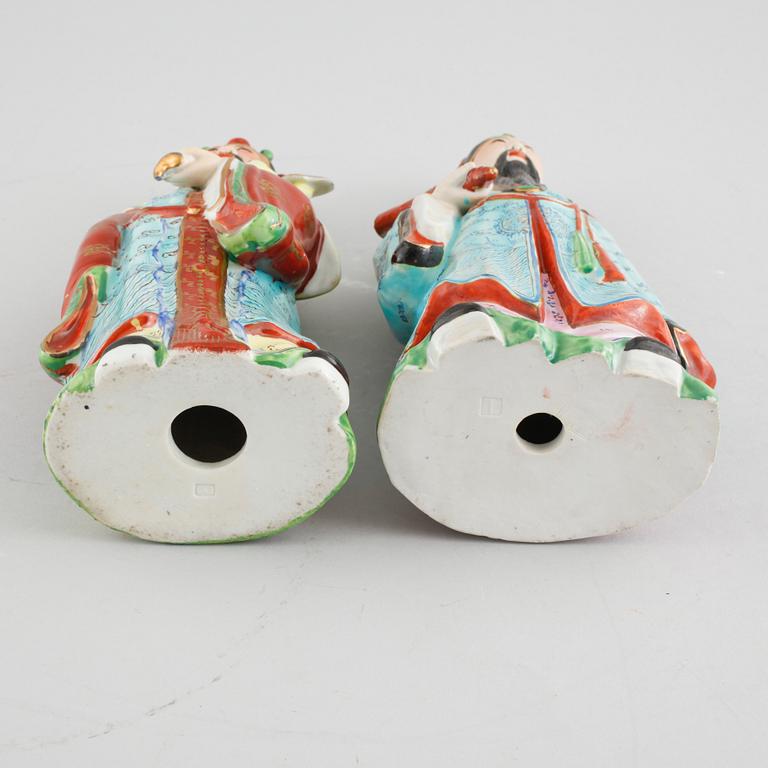 A pair of chinese figurines.