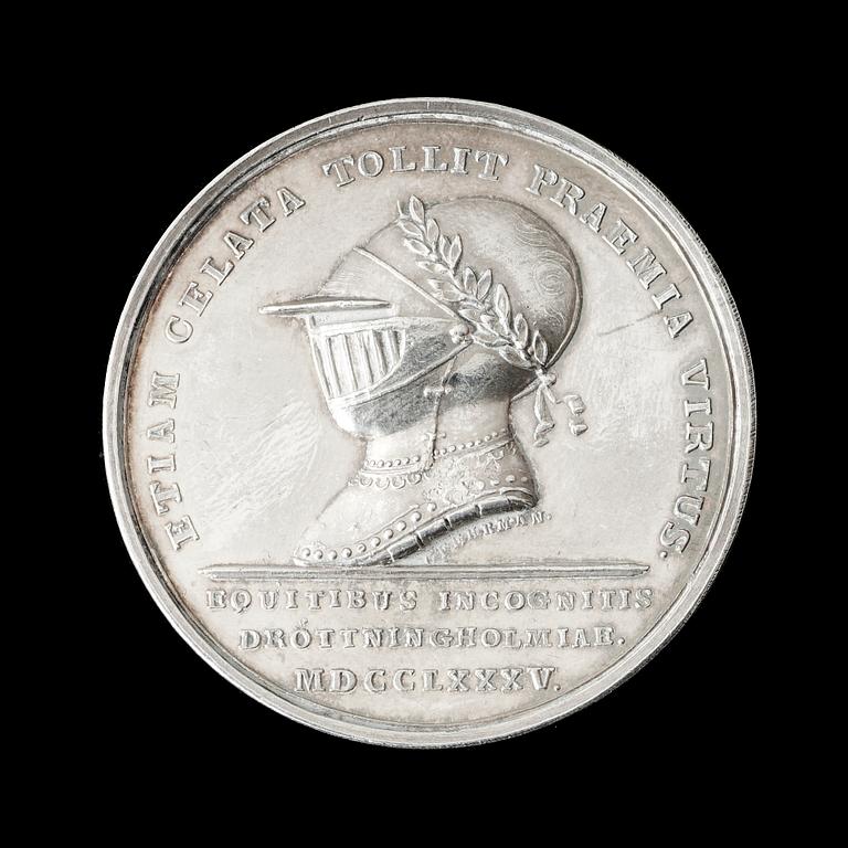 MEDALJ. Gustav III:s karusell/tornering på Drottningholm 1785. Utförd av G. Liungberger/C.G. Fehrman. Silver 4,2 cm 29 g.