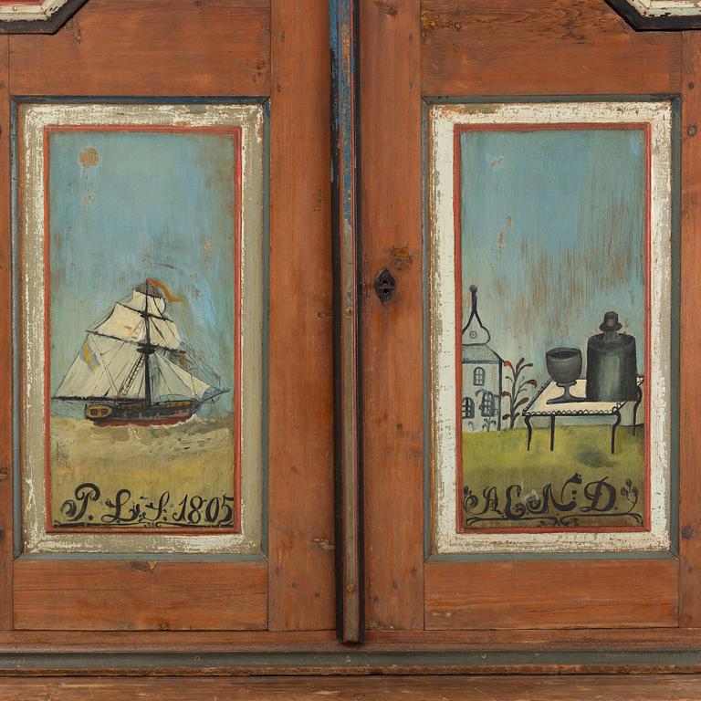 A Swedish polychrome.-painted cabinet, presumably from Halland, dated 1805.