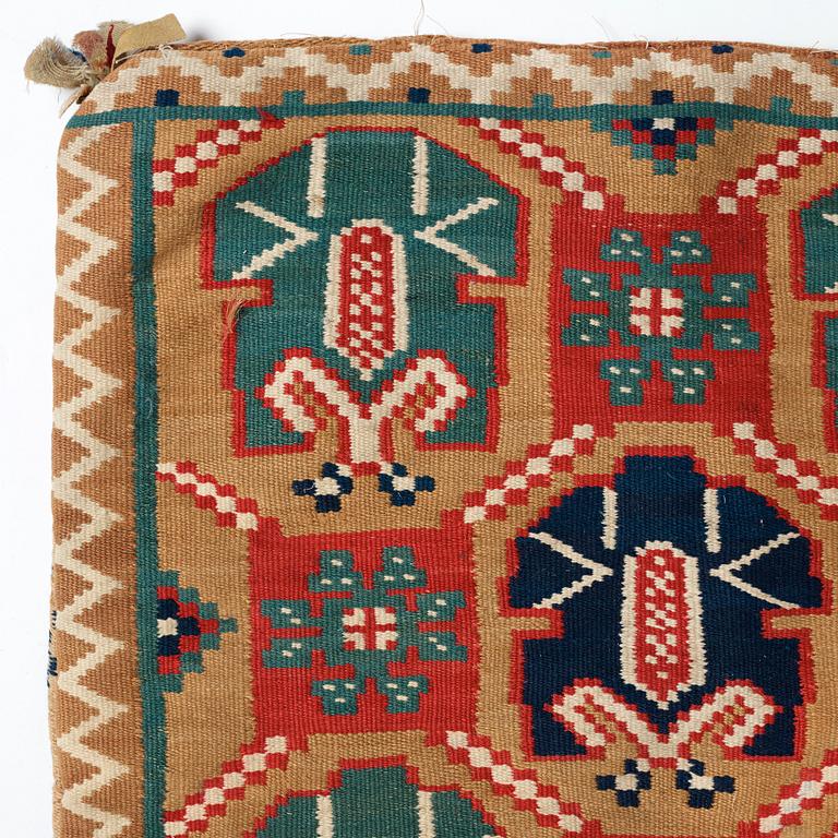 A CARRIAGE CUSHION, "Palmetter och blommor", double interlocked tapestry, ca 105 x 54,5 cm, Scania, Sweden,