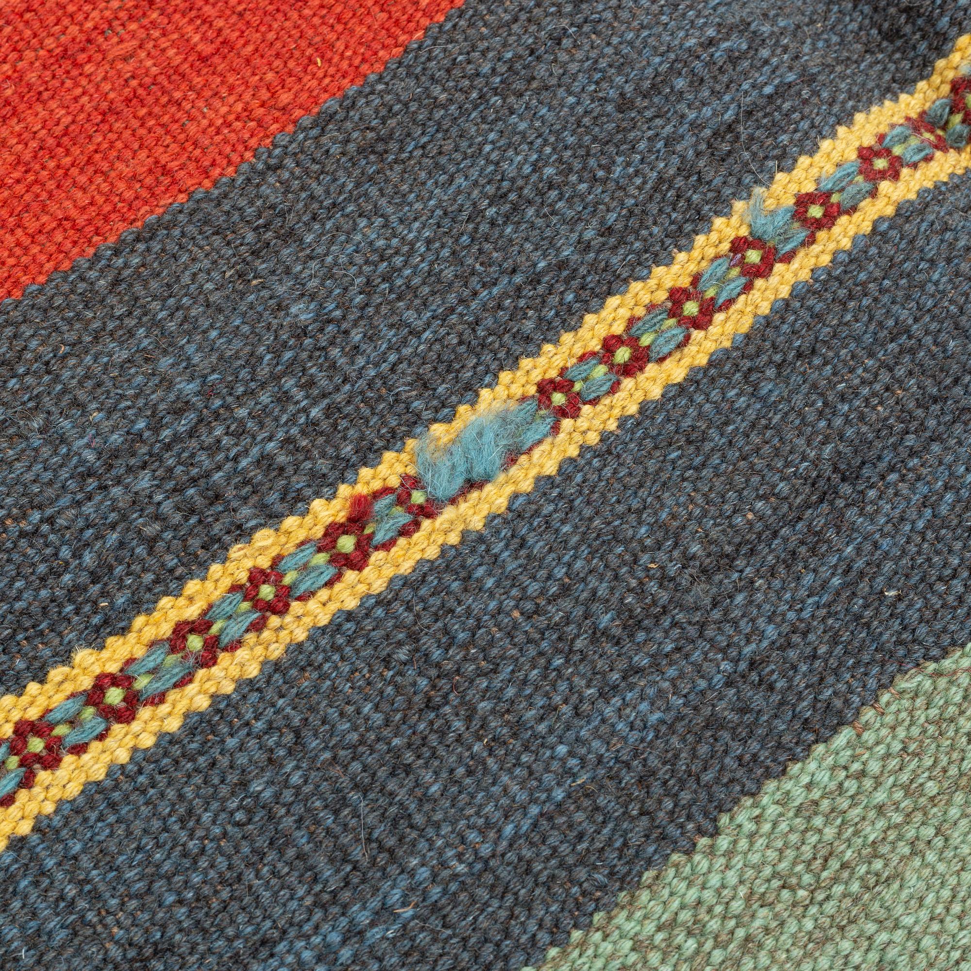 A persian kilim,  ca 242 x 181 cm.