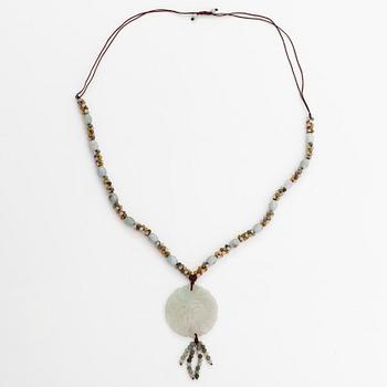 A collier with jade and nyon cord.