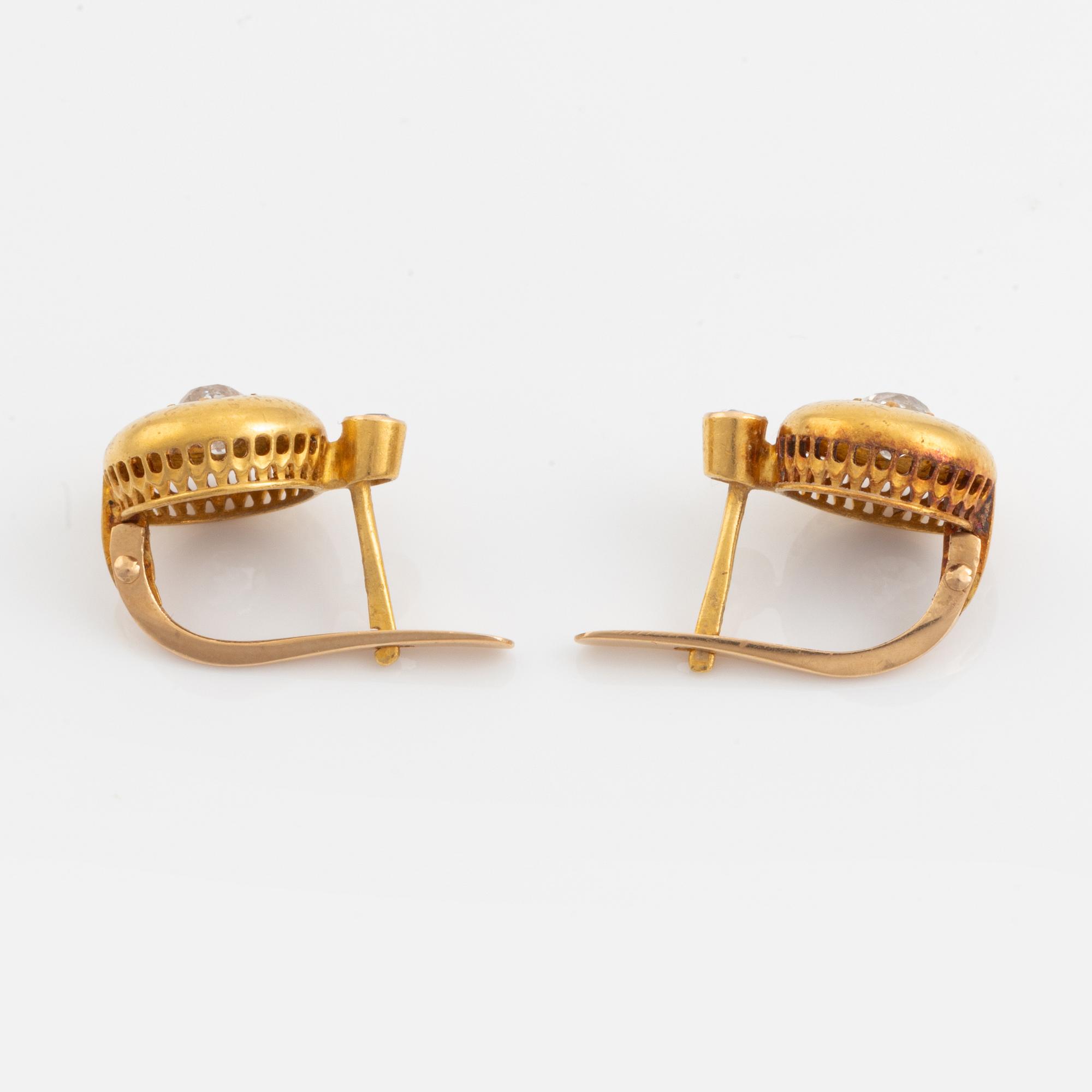 A pair of 18K gold earrings set with old-cut diamonds.