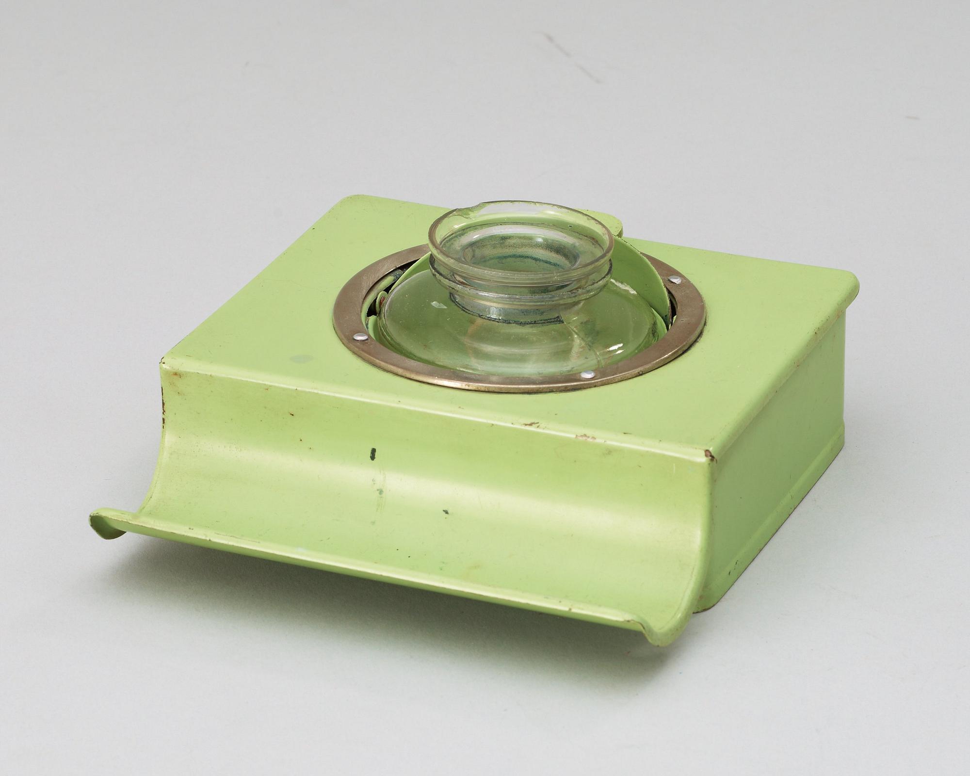 A Marianne Brandt enameled metal inkstand, a stamp dryer, and a bookend, Ruppelwerk, Gotha, Germany 1930's.