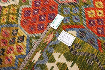 An Afghan Kilim carpet, c. 357 x 266 cm.