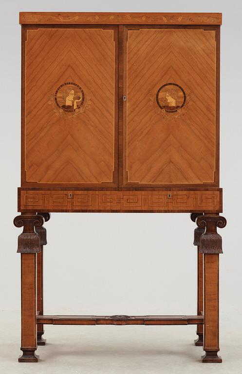 An Erik Matsson marquetry cabinet on stand, Carl Johansson Möblering AB, Stockholm 1932.