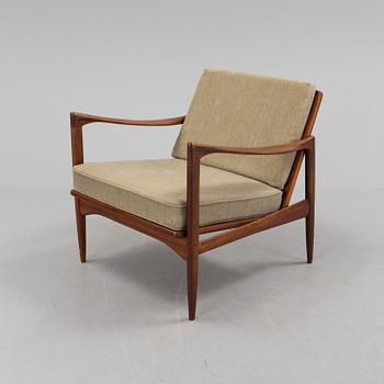 a 1960s teak "Kandidaten" armchair designed by IB Kofod Larsen for OPE Möbler, Jönköping.