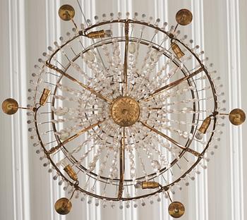 A late Gustavian gilt brass and cut glass seven-light chandelier, Stockholm, late 18th century.