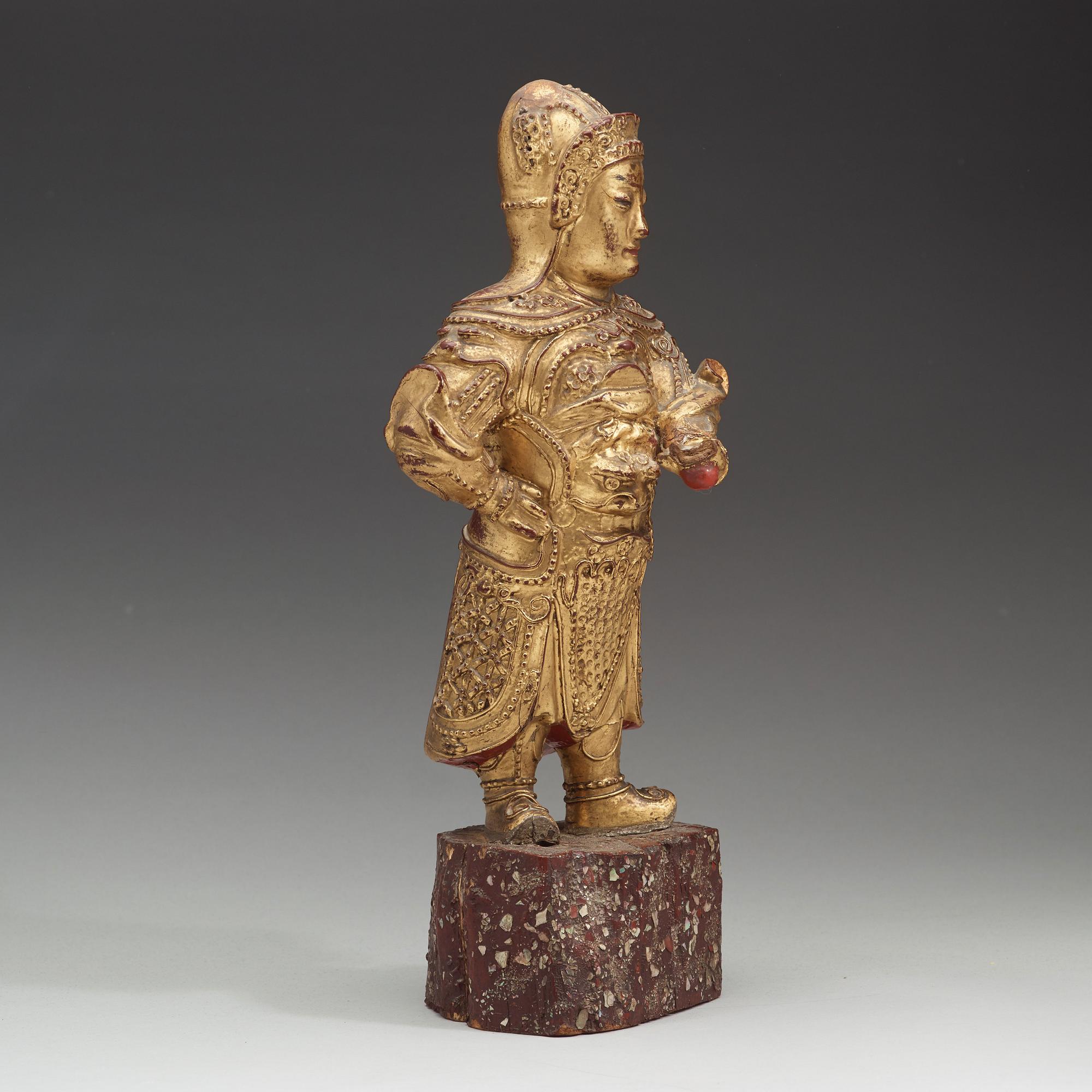 A wood sculpture of a guardian figure, (1644-1912).