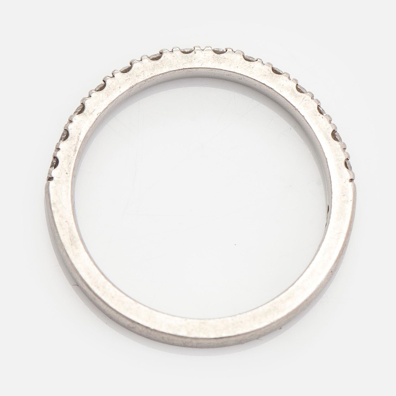 A platinum ring with brilliant cut diamonds.