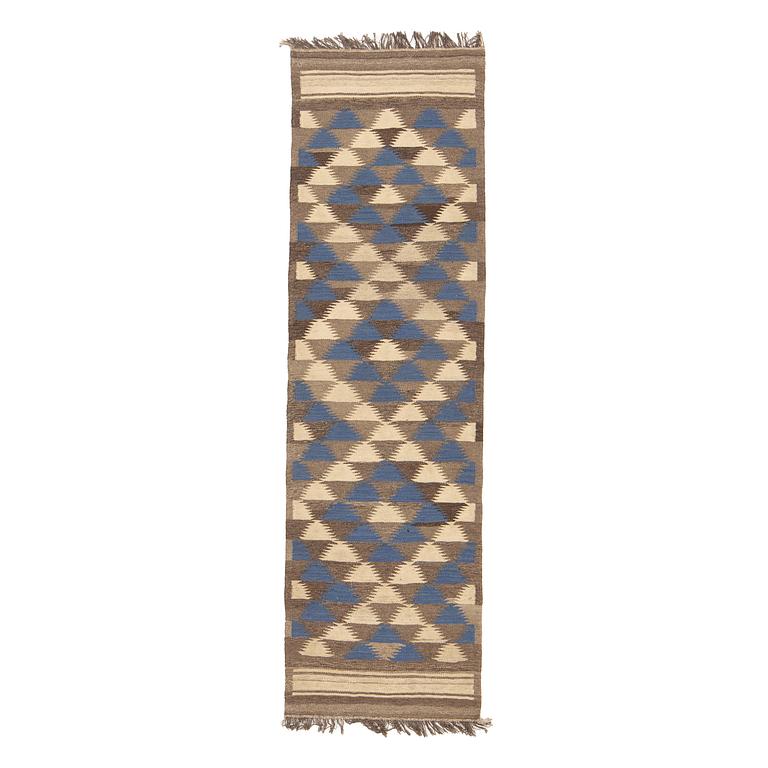 A persian kilim runner, c 250 x 74 cm.