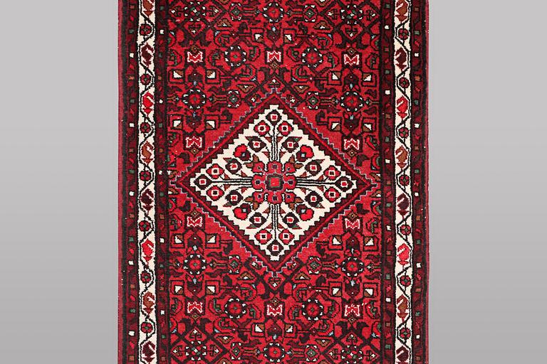 A runner carpet, Hosseinabad, ca 393 x 82 cm.