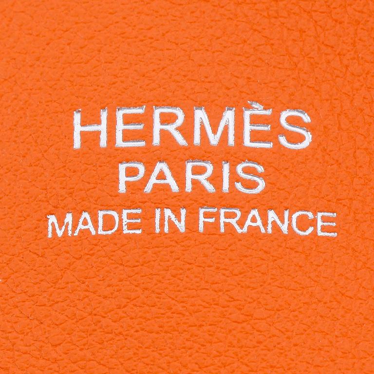 HERMÈS, a orange calf leather handbag, "Bolide".