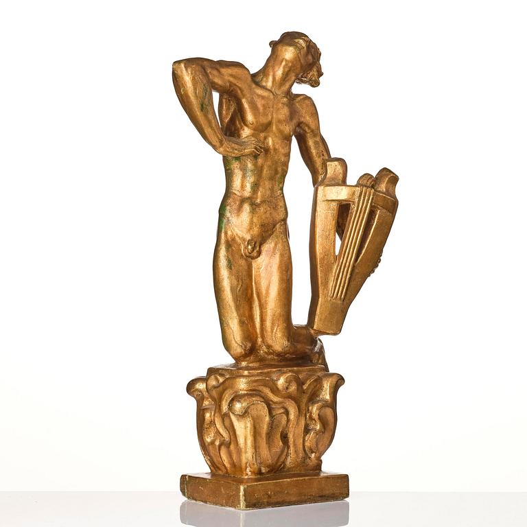 John Lundqvist, a gilded plaster sculpture of a lyre player, dated 1928.
