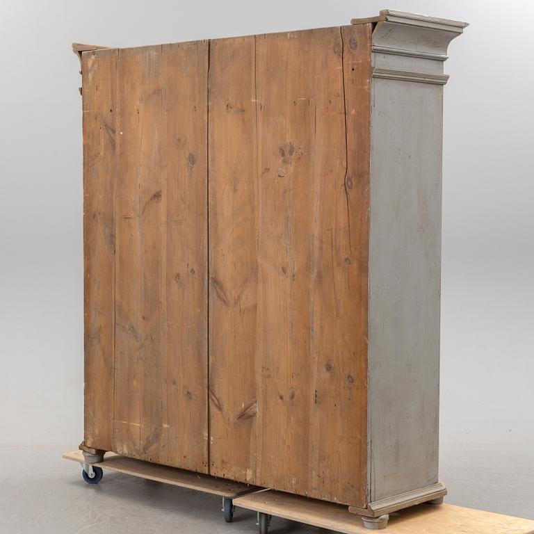 A mid 19th century painted wardrobe.