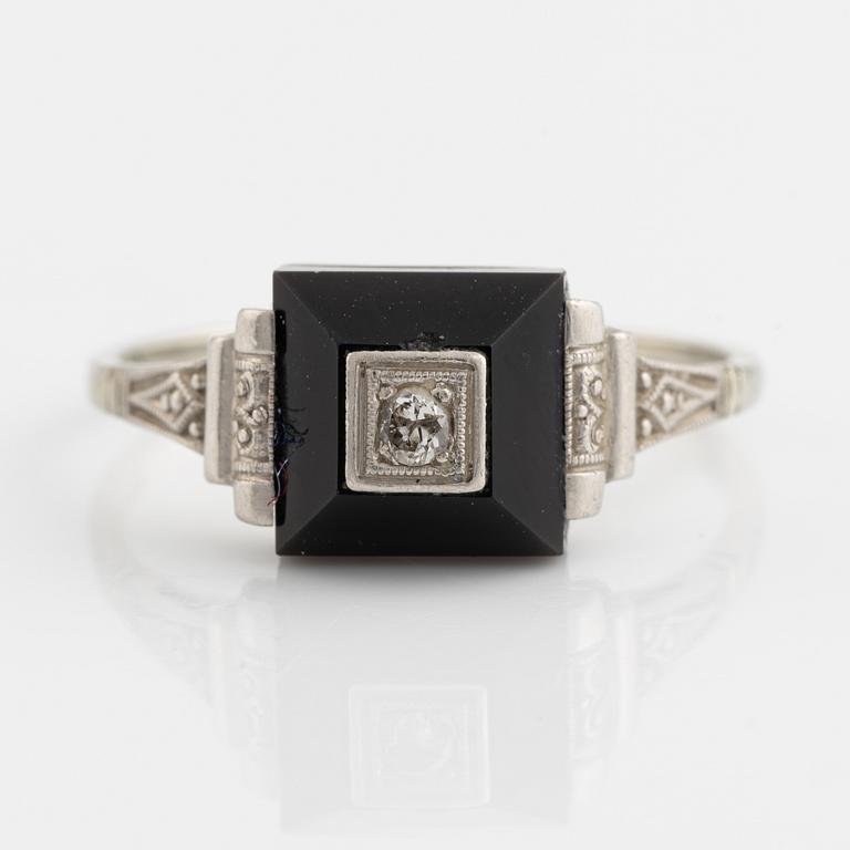 18K white gold, onyx with round brilliant cut diamond ring.