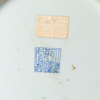 A blue and white lotus dish, Qing dynasty with a Qianlong mark and of the period (1736-95).