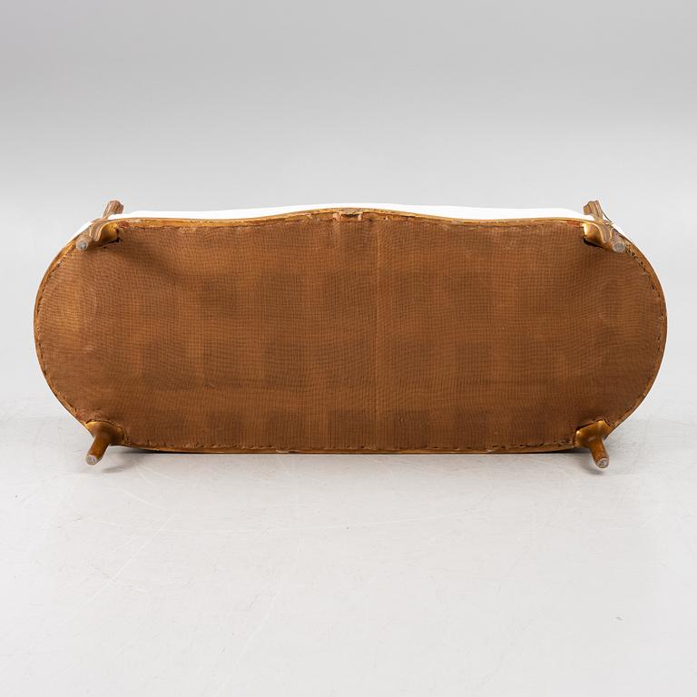 A Louis XV-style sofa, early 20th century.