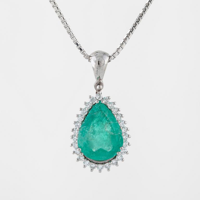 An emerald and brilliant cut diamond pendant.