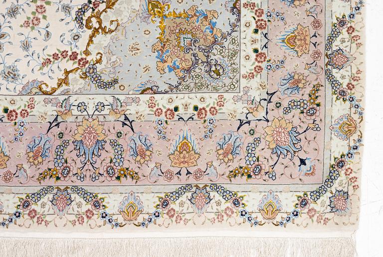 A Tabriz carpet north west Persia, part silk, c. 314 x 197 cm.