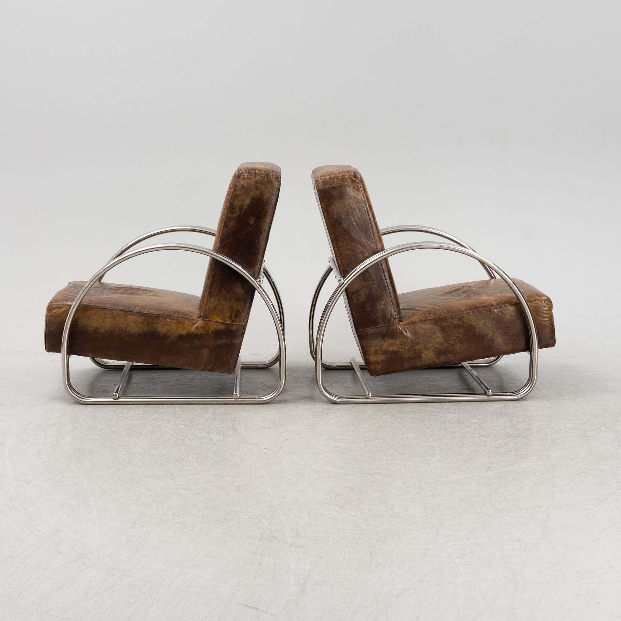 A pair of 'Hudson Street' lounge chairs from Ralph Lauren home.