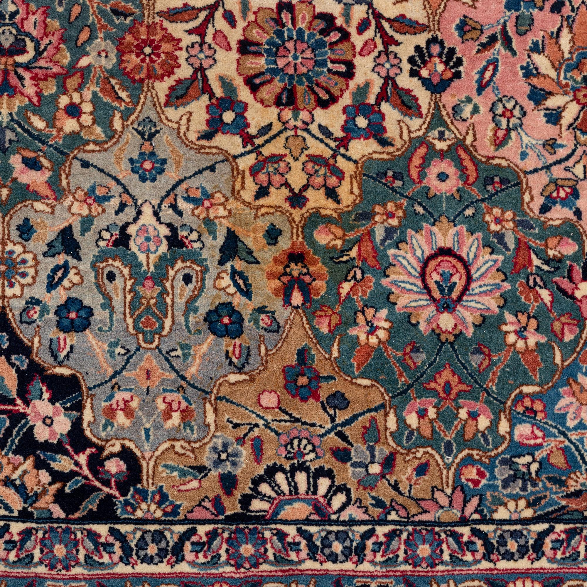 A semi-antique Kerman carpet, of Safavid 'vase' design, ca 484 x 291 cm.